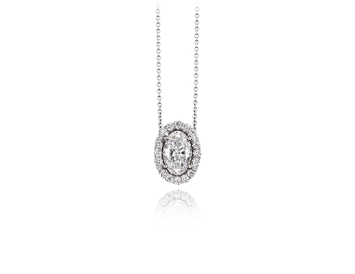 Oval and round brilliant cut diamond halo pendant in 18k white gold.