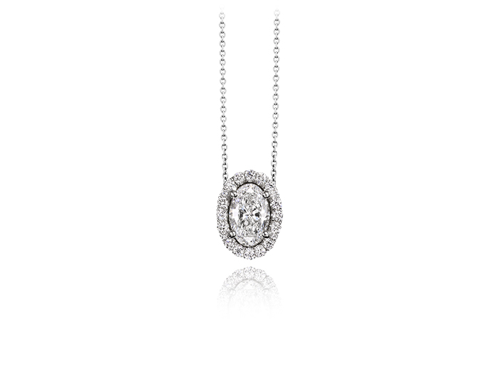 Oval and round brilliant cut diamond halo pendant in 18k white gold.