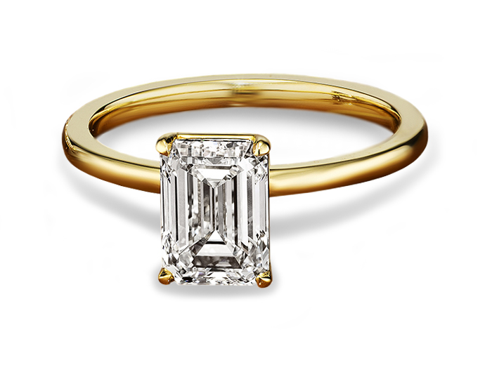 Emerald cut diamond engagement ring in 18k yellow gold.