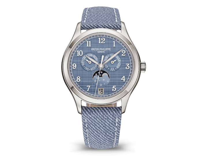 Patek Philippe Annual Calendar ref. 4946G-001 featuring a self-winding mechanical movement, "shantung" finish blue-gray dial, and a 38mm 18k white gold case on a calfskin strap with a prong buckle.
