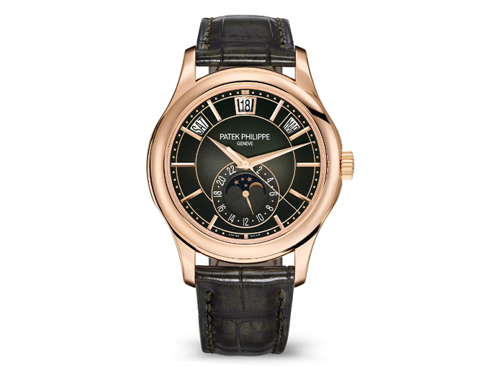 Patek Philippe Annual Calendar ref. 5205R-011 featuring a self-winding movement, sunburst olive green dial, and a 40mm 18k rose gold case on an alligator strap with a prong buckle.