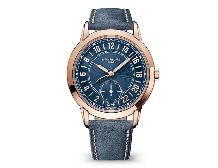 Patek Philippe 24-hour display Travel Time ref. 5224R-001 featuring a self-winding movement, blue dial, and a 42mm 18k rose gold case on a calfskin strap with a prong buckle.