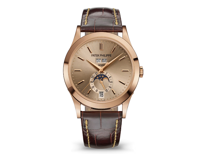 Patek Philippe Annual Calendar ref. 5396R-016 featuring a self-winding mechanical movement, sand beige dial, and a 38.5mm 18k rose gold case on an alligator strap with a fold-over clasp.