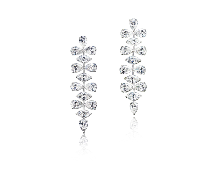 Pear shape and marquise cut diamond earrings in 18k yellow gold.