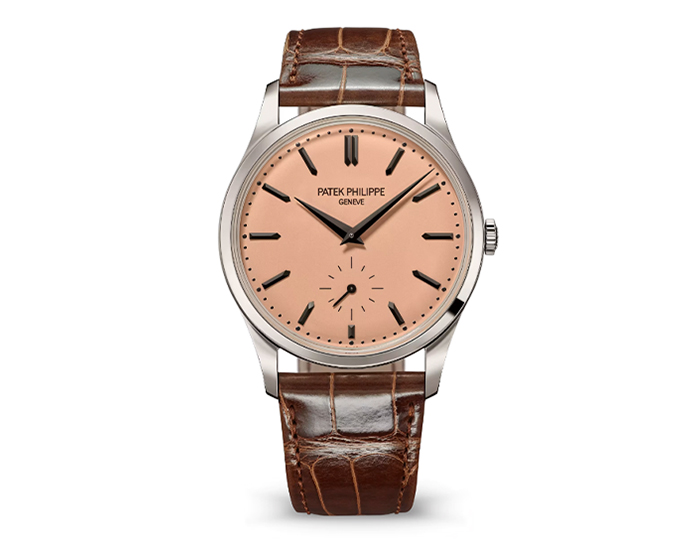 Patek Philippe Calatrava ref. 6196P-001 featuring a manually wound movement, rose-gilt opaline dial, and a 38mm platinum case on an alligator strap with a prong buckle.