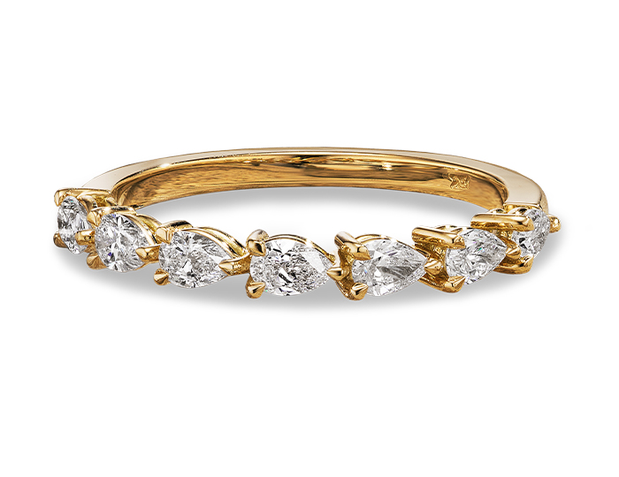 Pear shape diamond band in 18k yellow gold.