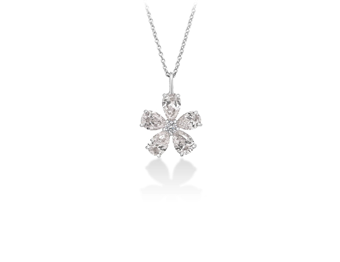 Roberto Coin Tiny Treasures collection pear shape and round brilliant cut diamond flower pendant in 18k white gold.