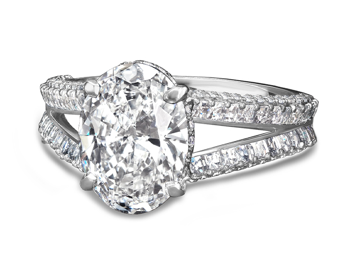 Bez Ambar oval, blaze, and round brilliant cut diamond engagement ring in platinum.