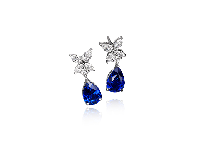 Sapphire and pear cut diamond earrings in 18k white gold.
