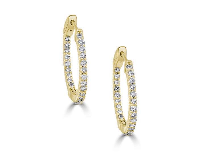 Round brilliant cut diamond hoop earrings in 18k yellow gold.