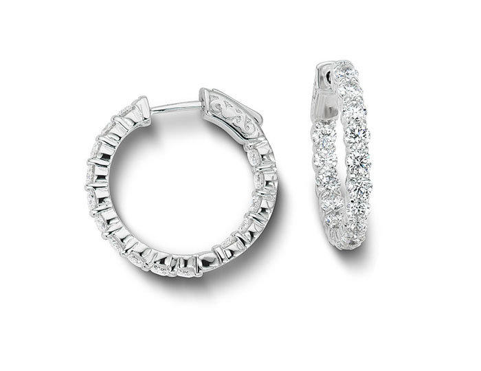 Round brilliant cut diamond hoop earrings in 18k white gold.