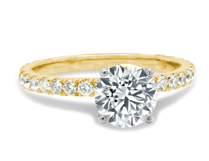 Round brilliant cut diamond engagement ring in 18k yellow gold.