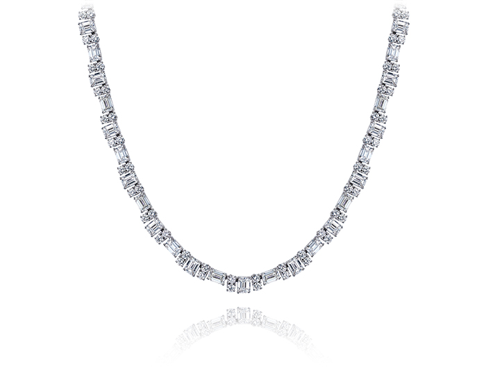 Emerald and round brilliant cut diamond necklace in platinum.
