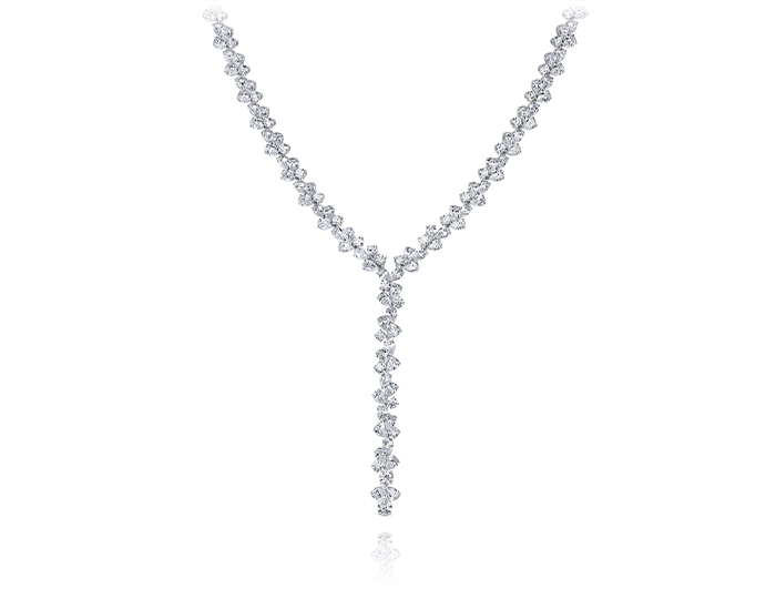 Pear shape and round brilliant cut diamond lariat necklace in 18k white gold.