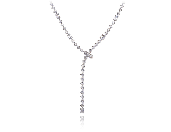 Emerald and round brilliant cut diamond lariat necklace in 18k white gold.
