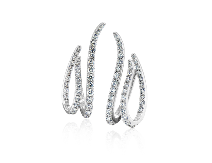 Round brilliant cut diamond earrings in 18k white gold.