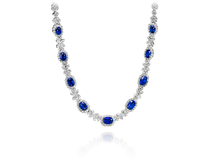 Oval sapphire, marquise and round brilliant cut diamond necklace in 18k white gold.
