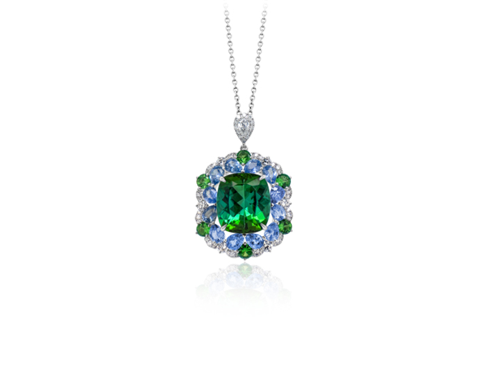 Cushion green tourmaline, pear shape sapphires, tsavorite, pear shape cut diamond and round brilliant cut diamond pendant in 18k white gold.
