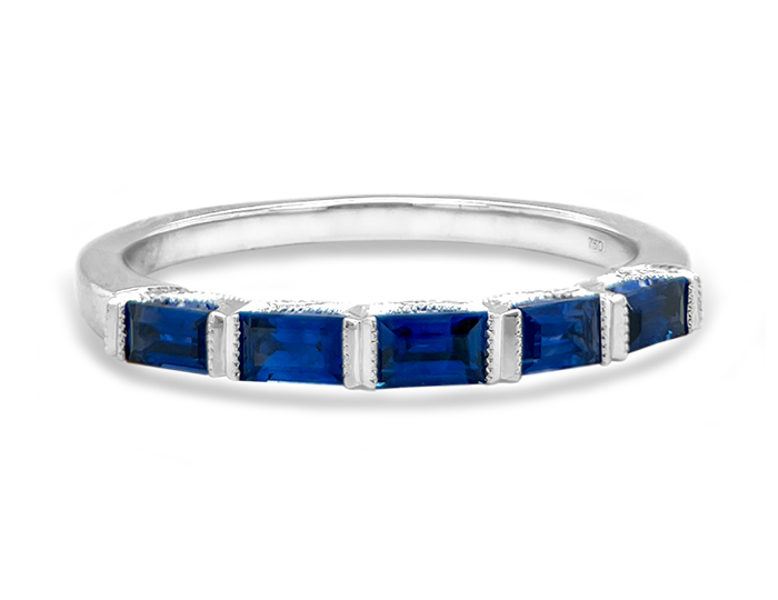 Baguette cut sapphire band in 18k white gold.
