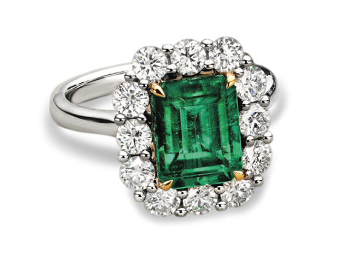 Emerald and round brilliant cut diamond ring in 18k yellow gold and platinum.