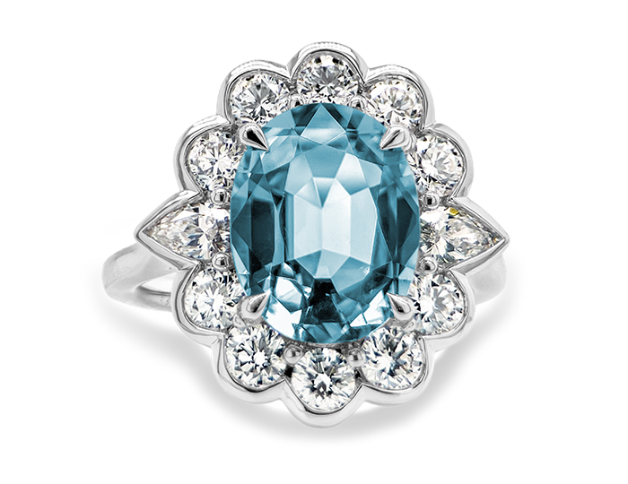 Aquamarine and pear shape and round brilliant cut diamond ring in 18k white gold.