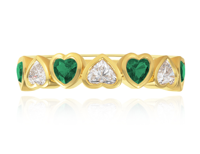 Emerald and heart shape diamond ring in 18k yellow gold.
