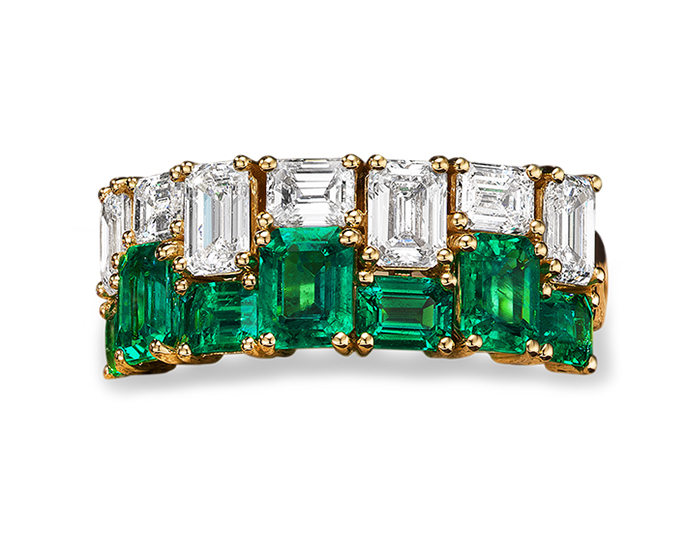 Emerald and emerald cut diamond ring in 18k yellow gold.
