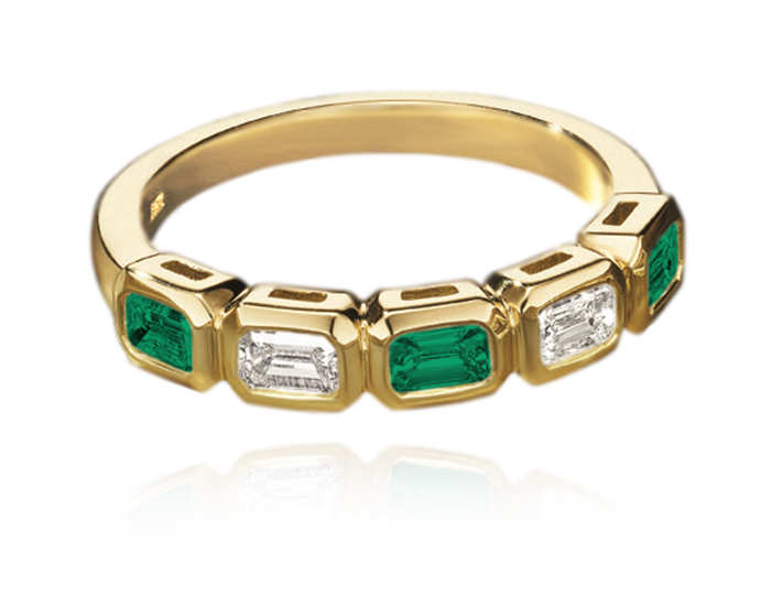Emerald and emerald cut diamond ring in 18k yellow gold.