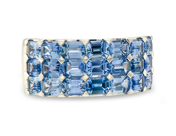 Emerald cut sky blue sapphire ring in 18k white gold.