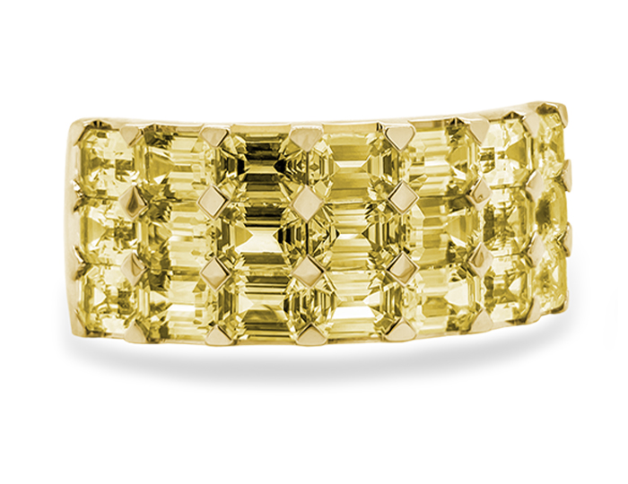 Emerald cut yellow sapphire ring in 18k yellow gold.