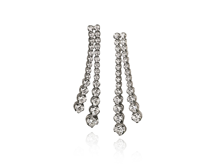 Round brilliant cut diamond earrings in 18k white gold.