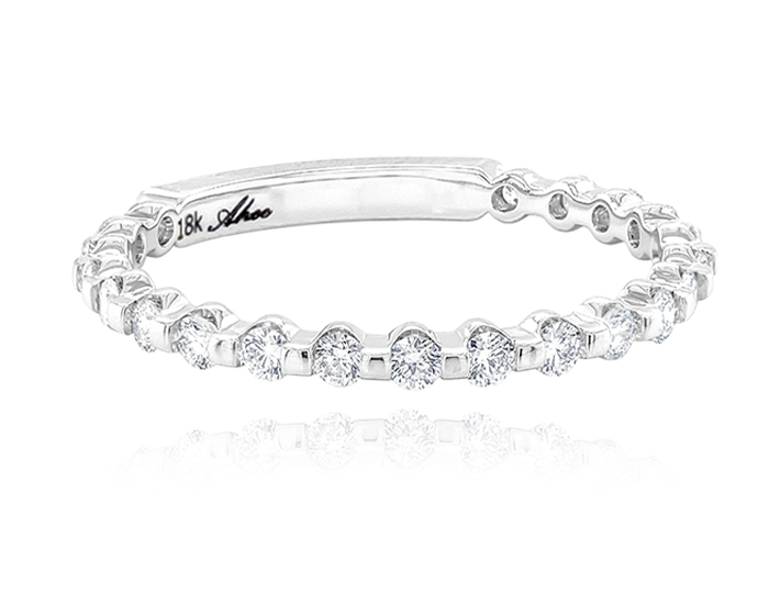 Round brilliant cut diamond band in 18k white gold.