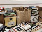 boxes and bags full of books