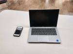 laptop and cell phone on a table