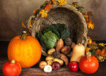 cornucopia with pumpkins, squash, potatoes and vegetables