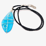blue piece of sea glass wrapped in silver wire. the glass is a pendant on a piece of black cord.