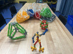 bags of colorful construction toys with simple model examples
