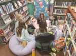 teens sitting in circle on library floor