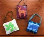 three felt sewn ornaments