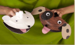 Paper plates folded in half to make puppy puppets with big mouths