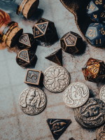 dice and coins scattered on tabletop