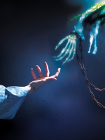 Ghostly skeleton hand reaching for human hand in striped pajama sleeve.