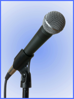microphone mounted on stand in front of blue background