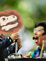 A female scientist with short, dark hair shrieks in excitement while another young scientist, sporti
