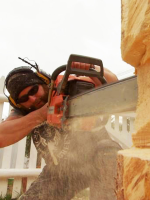 artist and author Jesse Green using a chainsaw