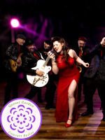 Little Miss (singer) in retro red dress with band behind her