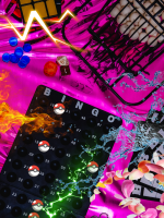 Bingo supplies are set out on top of hot pink silky fabric. Lightning bolts, splashes of water, and 