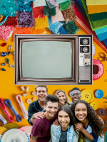 Craft supplies with a group of teens and a retro TV in front of it.