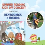 Seed and Egg sitting on a blanket on the farm with Ben Rudnick playing a guitar.