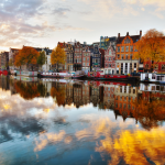 Amsterdam city view with Amstel river at sunrise